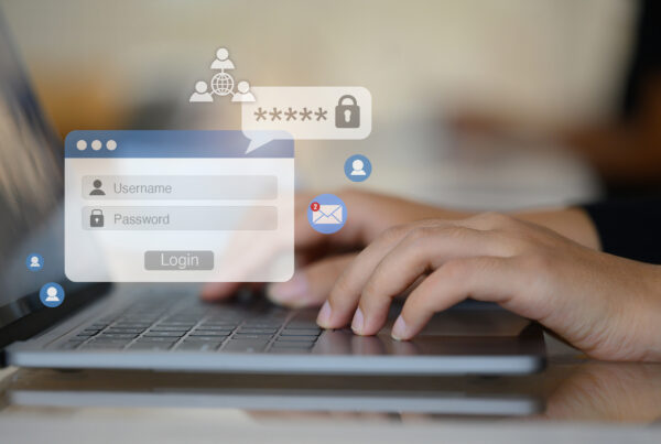 Woman hands typing username and password on her laptop to access account on website